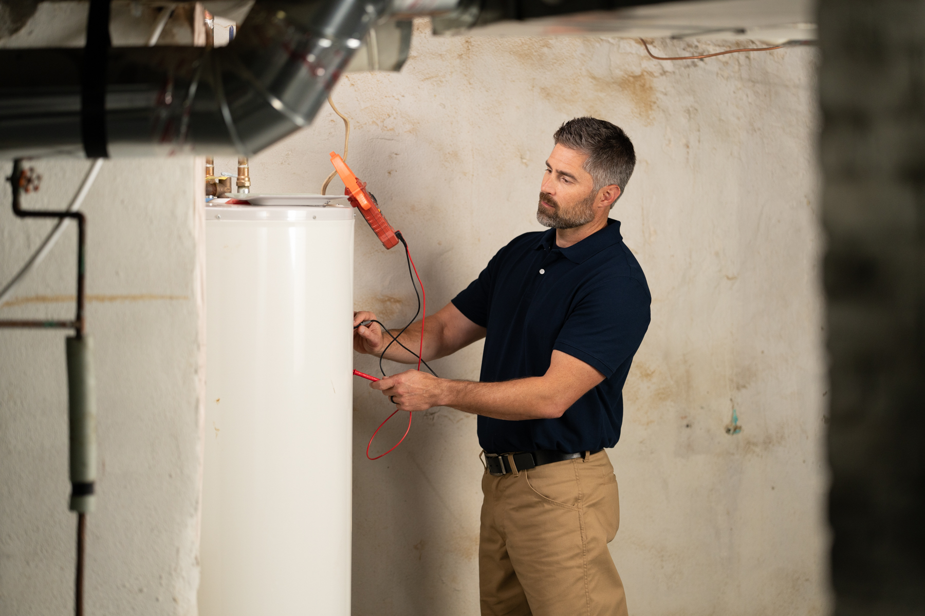 image of technician and water heater